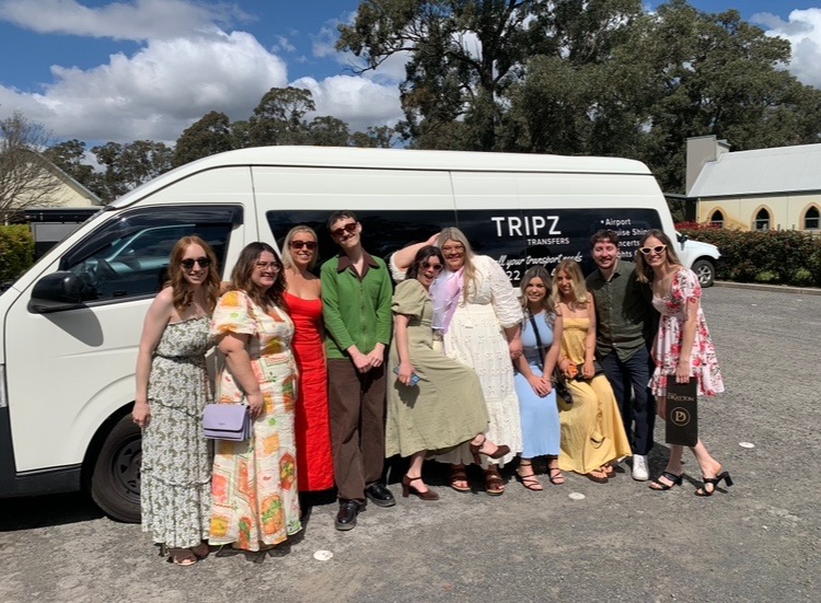 Hen party group standing beside the TRIPZ van