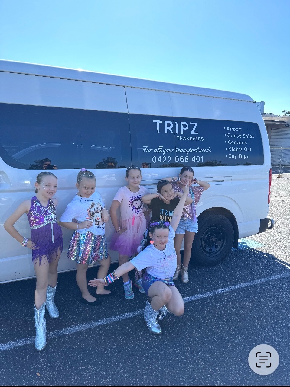 Children celebrating a birthday beside the TRIPZ van