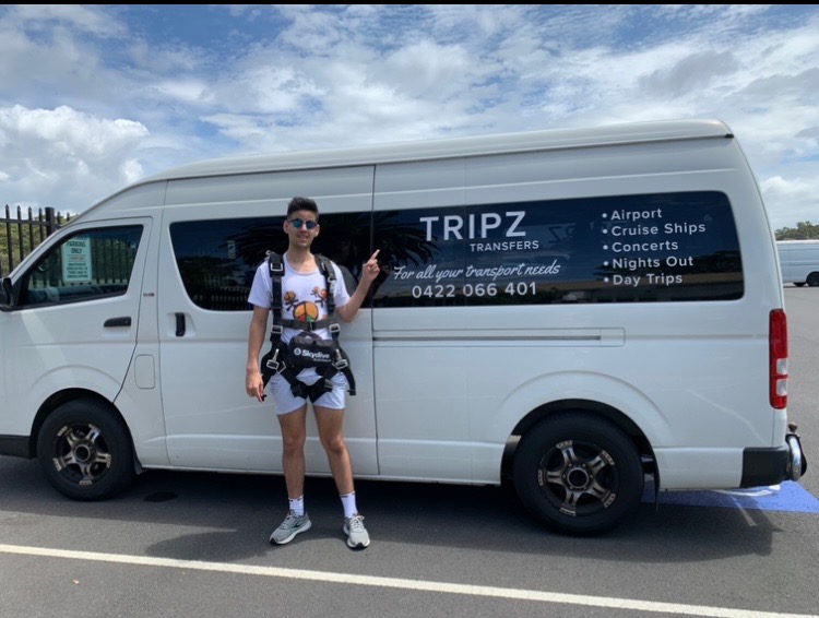 Passenger beside the TRIPZ van ahead of a parachute jump in Newcastle